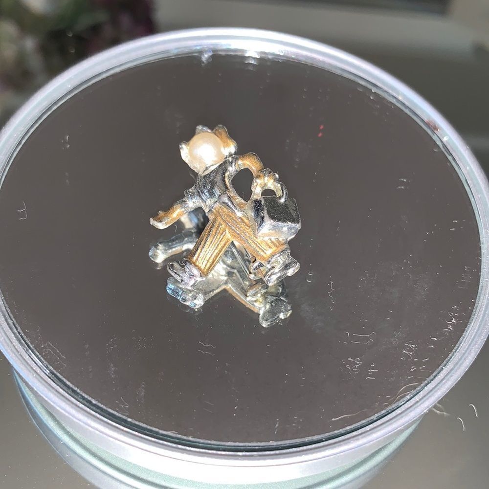 Vtg small silver brooch/pin of man walking with suitcase or briefcase
